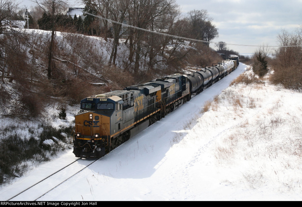 On a very cold day, CSX 877 & 5491 bring Q326 eastward on the GR Sub